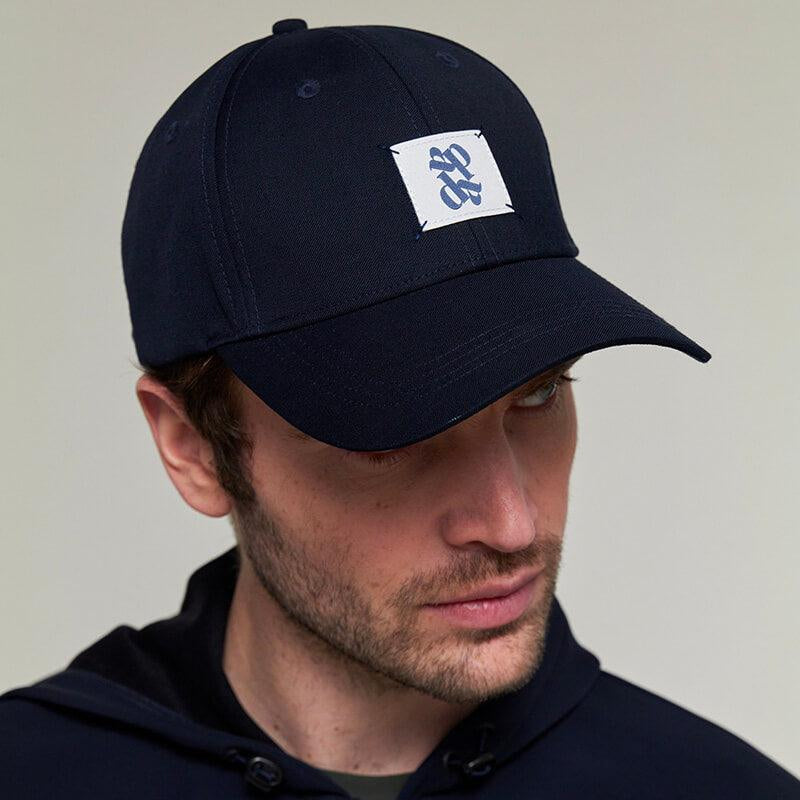 Dada Sport Arko Cap - STRĒID. Unisex rider baseball cap in Navy or Off White with UPF 50+ protection, Dada woven label, and adjustable gold clasp