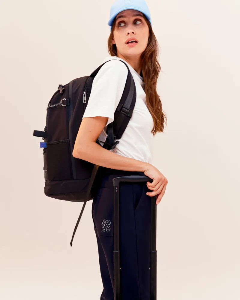 Dada Sport Mumbai Grooming Bag Black - STRĒID. Compact black grooming bag with Aquazip closure, multiple pockets, helmet net, padded straps, water-repellent polyester.