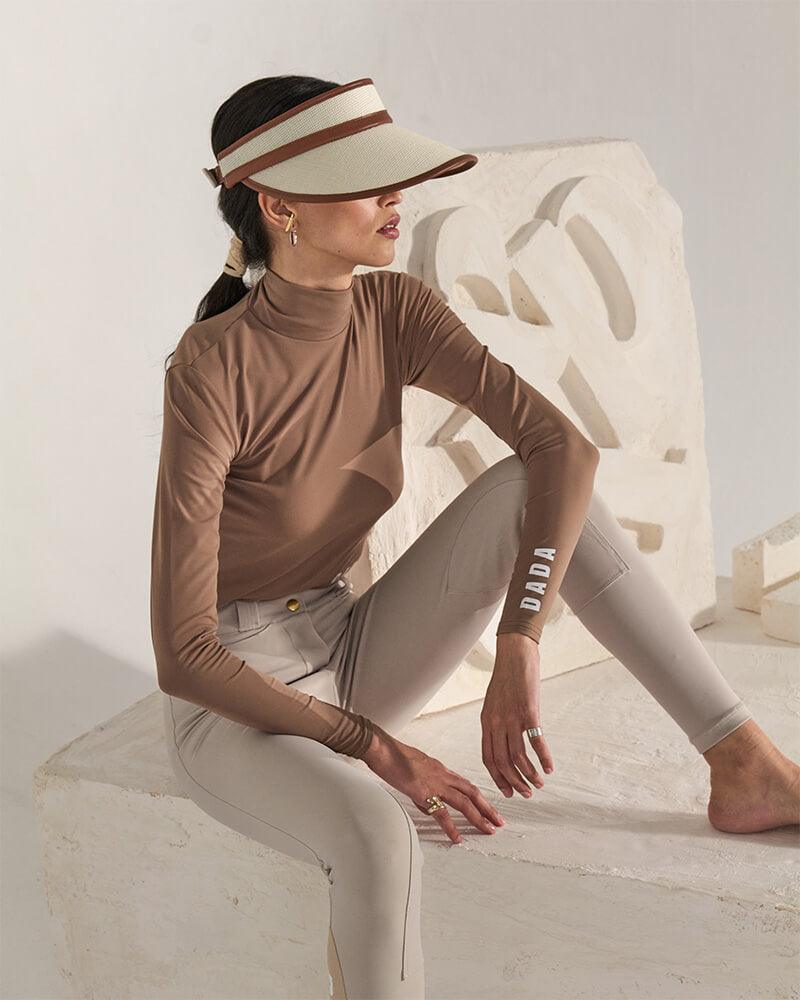 Dada Sport Sultane Riding Visor - STRĒID. Stylish adjustable visor with synthetic leather and gold logo for outdoor activities.