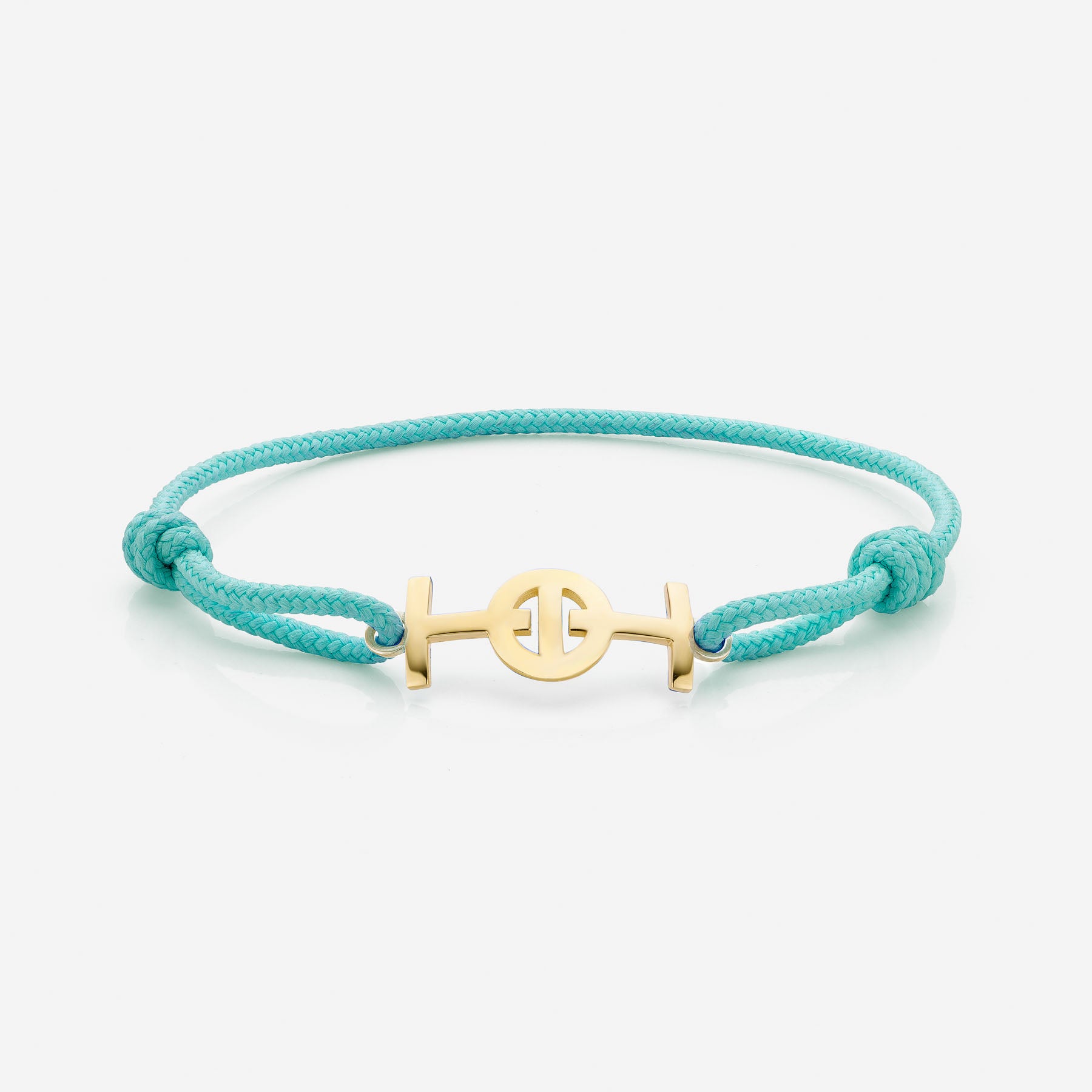Gold 9KT Challenge Cord Bracelet in Aqua Blue by TOTI - Strēid. Inspirational monogram bracelet with vibrant aqua blue cord and empowerment symbolism.