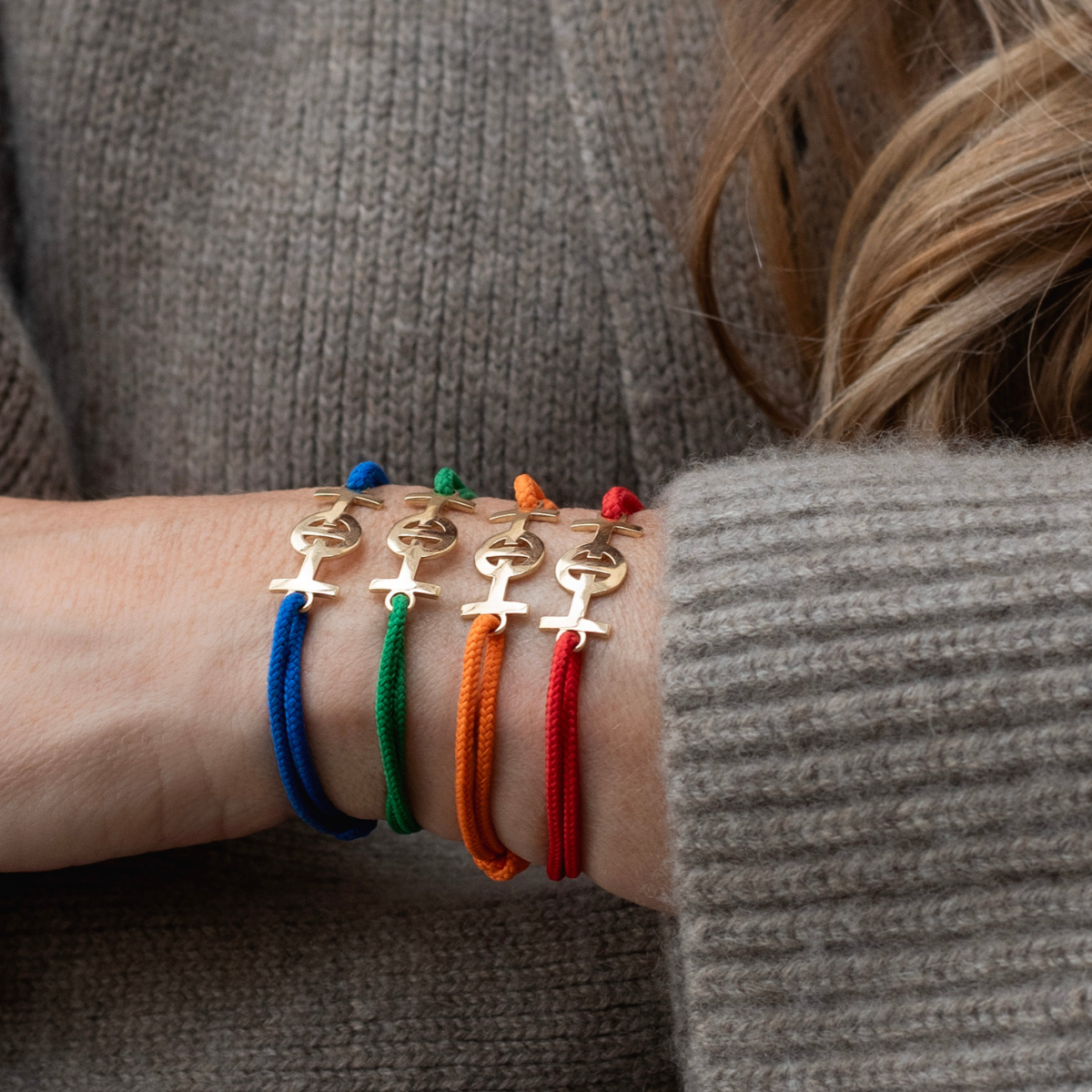 Gold 9KT Challenge Cord Bracelet in Blue by TOTI - Strēid. Vibrant monogram bracelet with empowerment symbolism and durable blue cord.