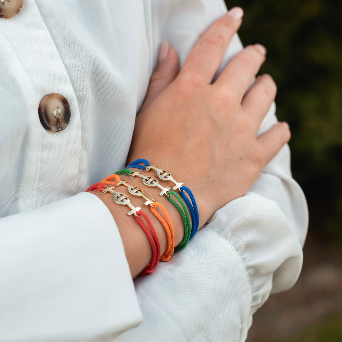 Gold 9KT Challenge Cord Bracelet in Red by TOTI - Strēid. Bold monogram bracelet with vibrant red cord and empowerment symbolism