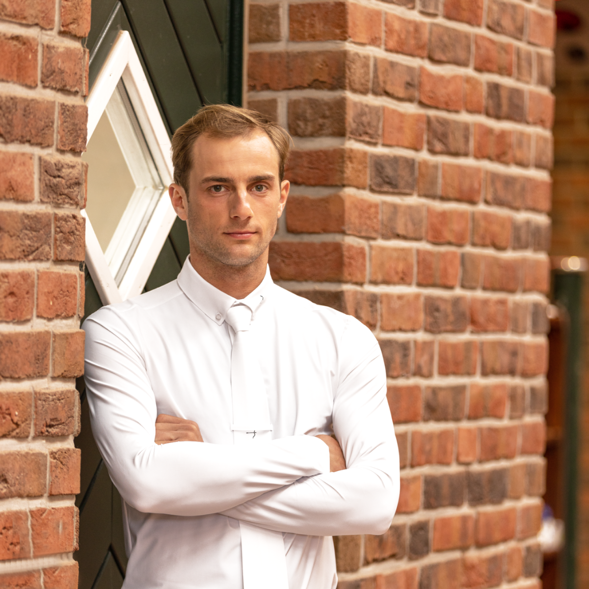 Logan White Competition Shirt by LAGUSO - Strēid. Breathable equestrian long-sleeve shirt with LPF 50 and bi-elastic fabric