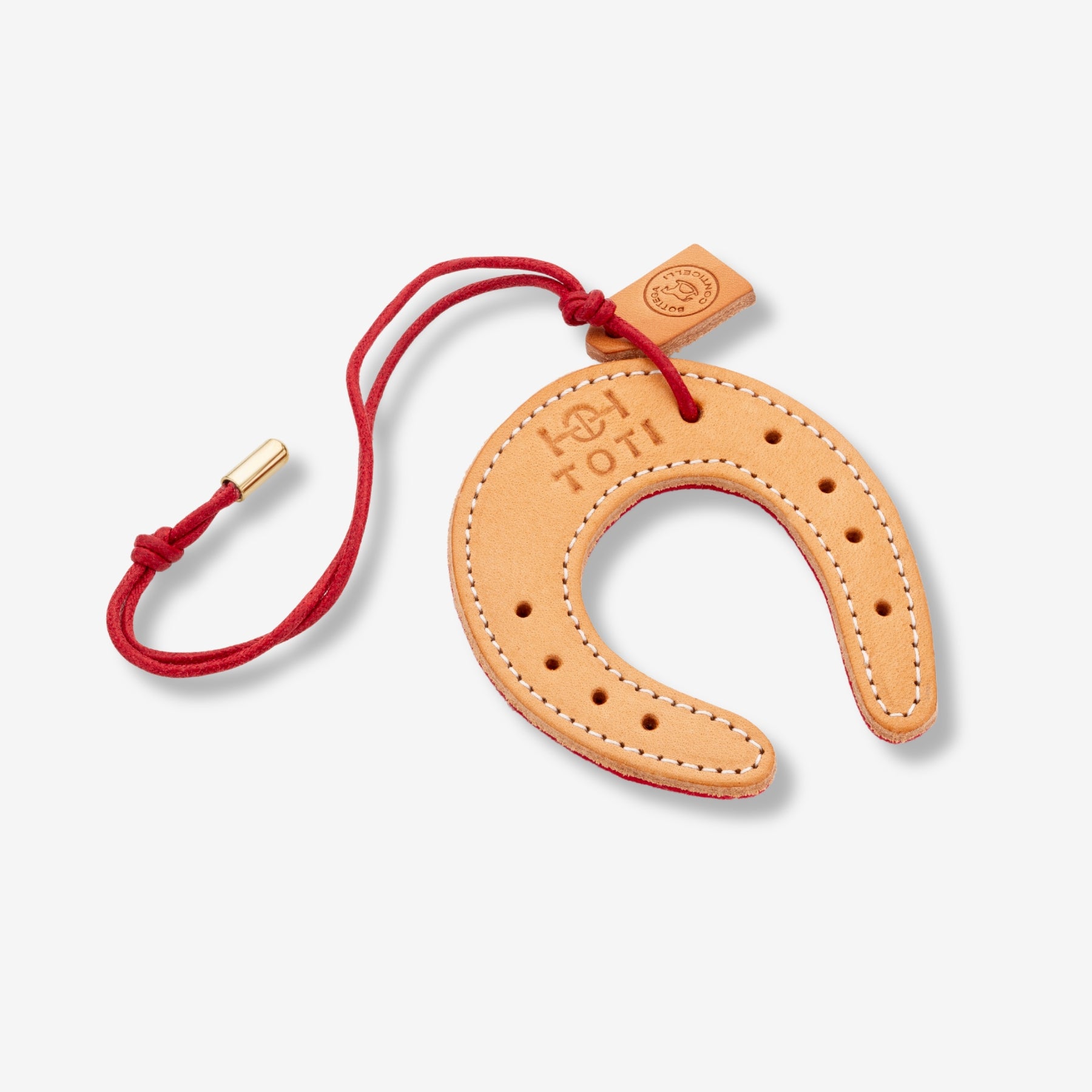 Lucky Charm by TOTI - Strēid. Equestrian-inspired horseshoe charm symbolizing success and confidence.