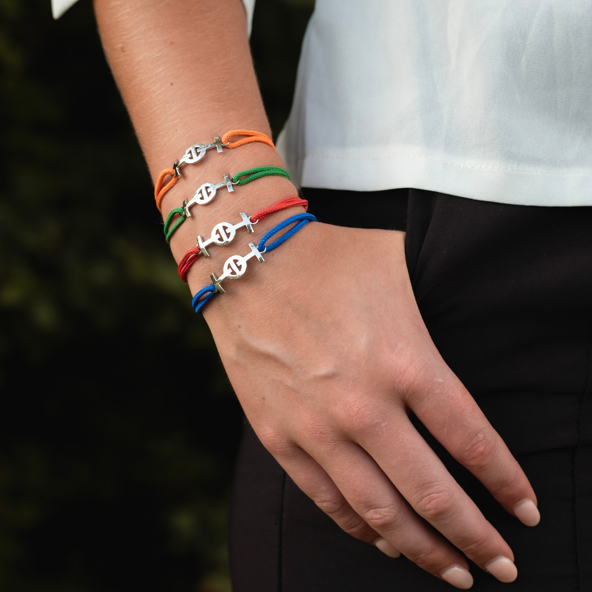 Silver Challenge Cord Bracelet in Red by TOTI - Strēid. Bold monogram bracelet with red cord and empowerment symbolism