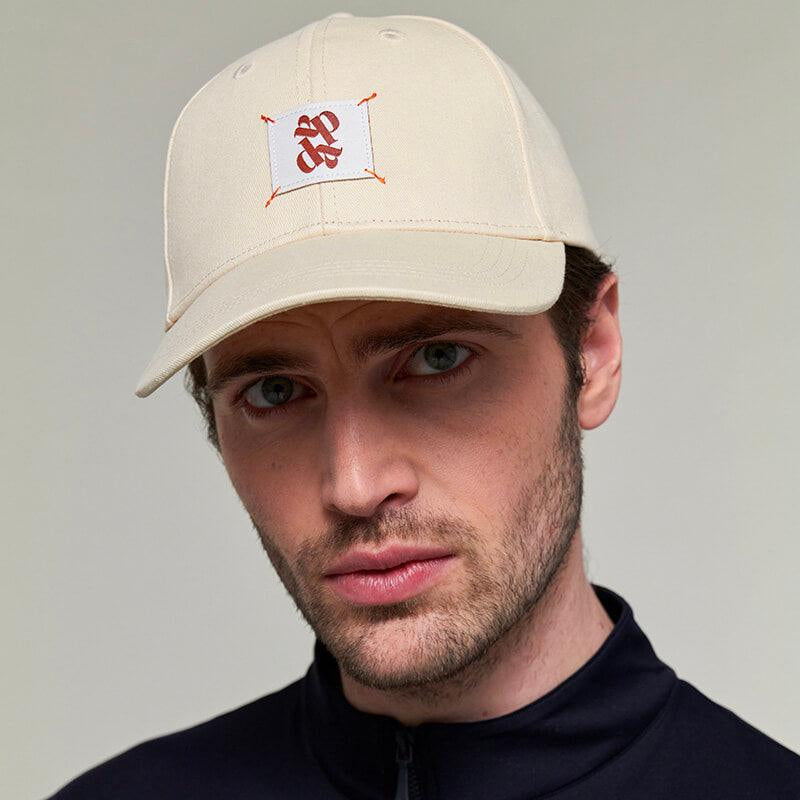 Dada Sport Arko Cap - STRĒID. Unisex rider baseball cap in Navy or Off White with UPF 50+ protection, Dada woven label, and adjustable gold clasp