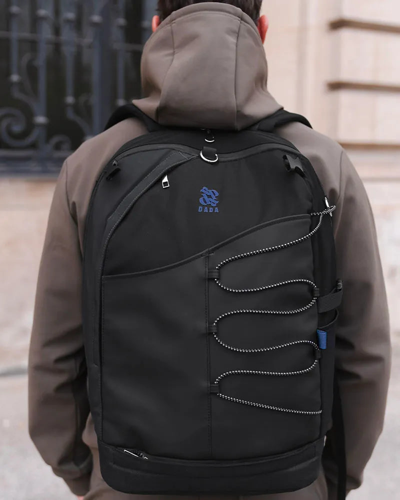 Dada Sport Mumbai Grooming Bag Black - STRĒID. Compact black grooming bag with Aquazip closure, multiple pockets, helmet net, padded straps, water-repellent polyester.
