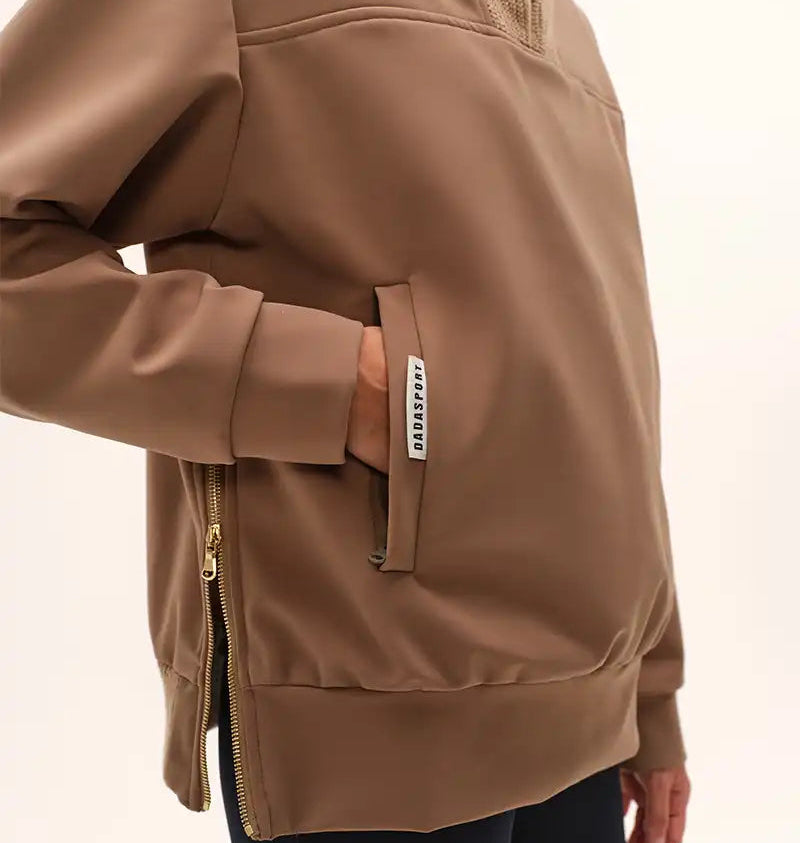 Dada Sport Urvoso Jacket Mocha - STRĒID. Thermal mocha riding jacket with gold zippers, kangaroo pockets, side vents, Sensitive Italian fabric made in Portugal.