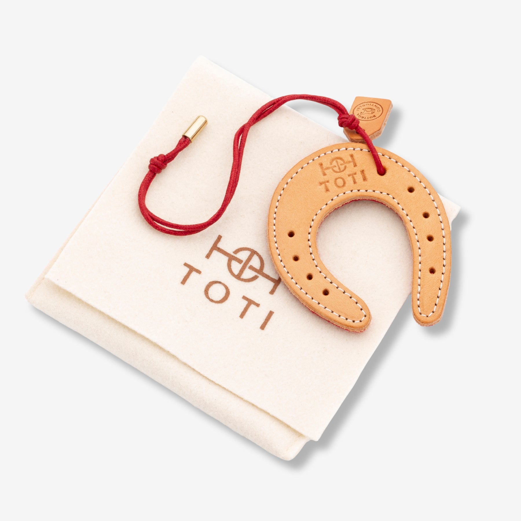 Lucky Charm by TOTI - Strēid. Equestrian-inspired horseshoe charm symbolizing success and confidence.

